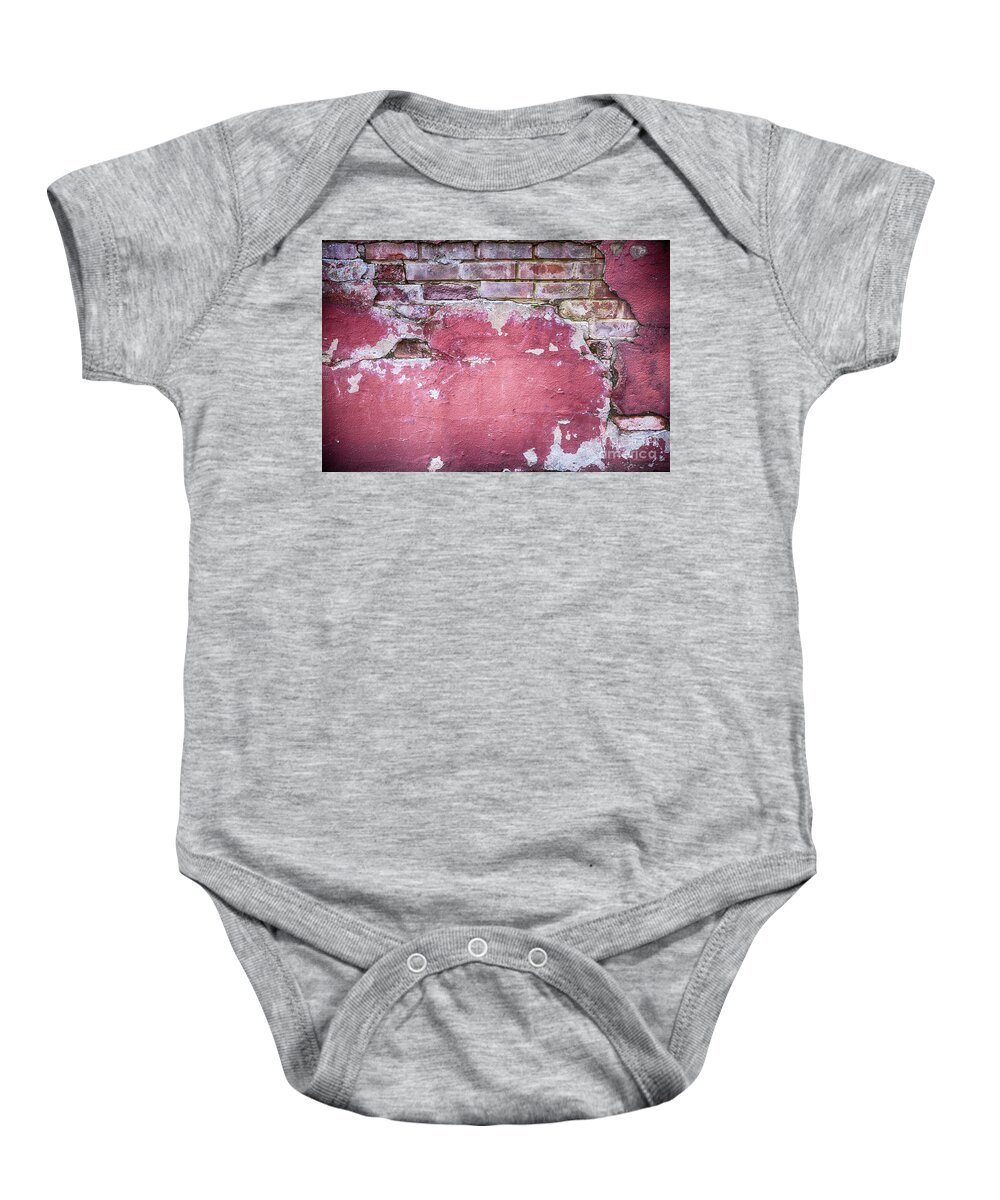 Abandoned Baby Onesie featuring the photograph Grunge red wall with broken plaster by Simon Bratt