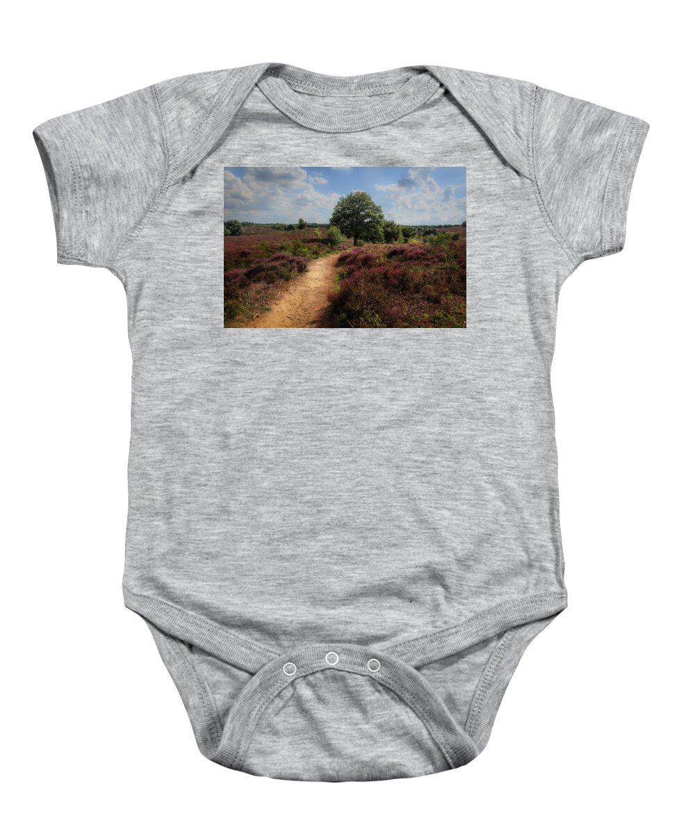 Beautiful Baby Onesie featuring the photograph Heath landscape with purple heather flowers by Tim Abeln