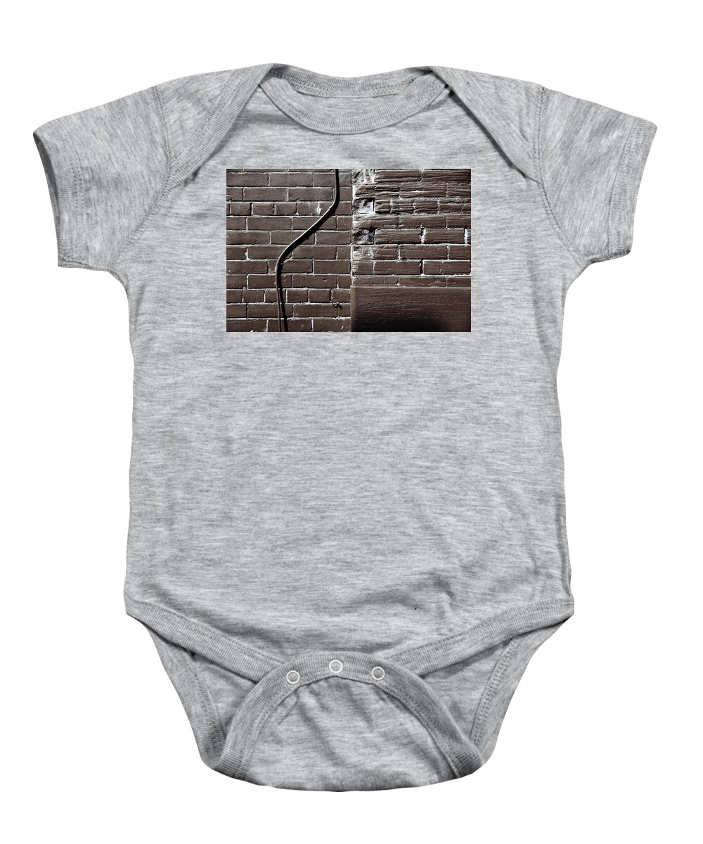 Brown Baby Onesie featuring the photograph In Defiance Of Rigidity by Kreddible Trout