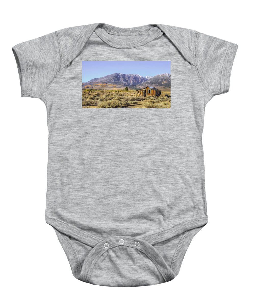 Old Barn Baby Onesie featuring the photograph Lone on the range by Charles Garcia