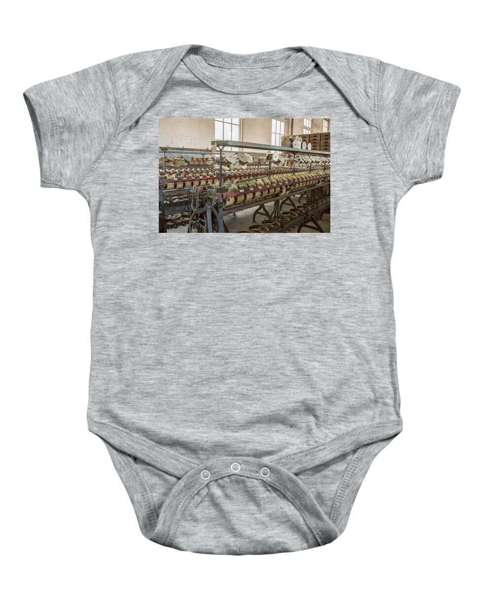 Abandoned Baby Onesie featuring the photograph Machinery and thread spools by Karen Foley