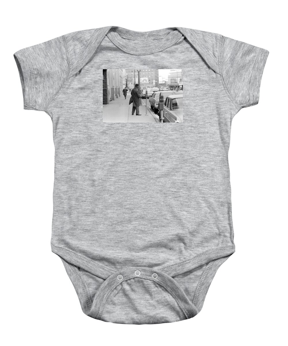 Actions Baby Onesie featuring the photograph Plugging the meter by Mike Evangelist