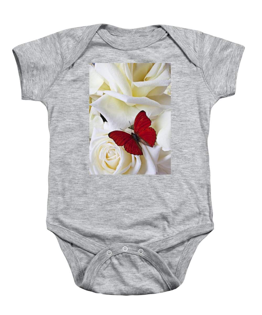 Red Baby Onesie featuring the photograph Red butterfly on white roses by Garry Gay