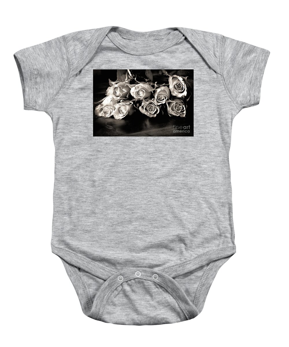 Roses Baby Onesie featuring the photograph Roses on a table in black and white by Simon Bratt
