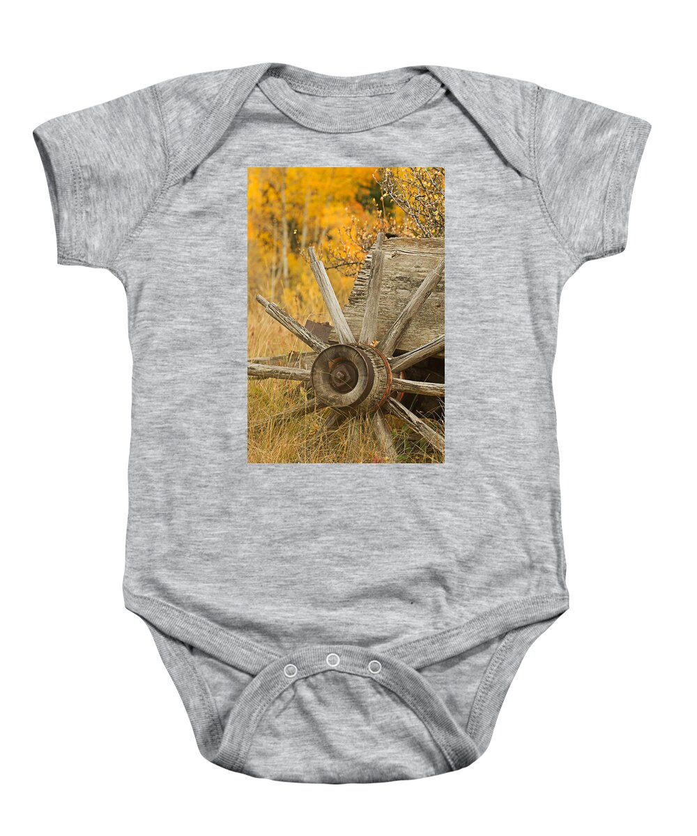 Wagon Baby Onesie featuring the photograph Rustic Wagon Wheel by Ronda Kimbrow