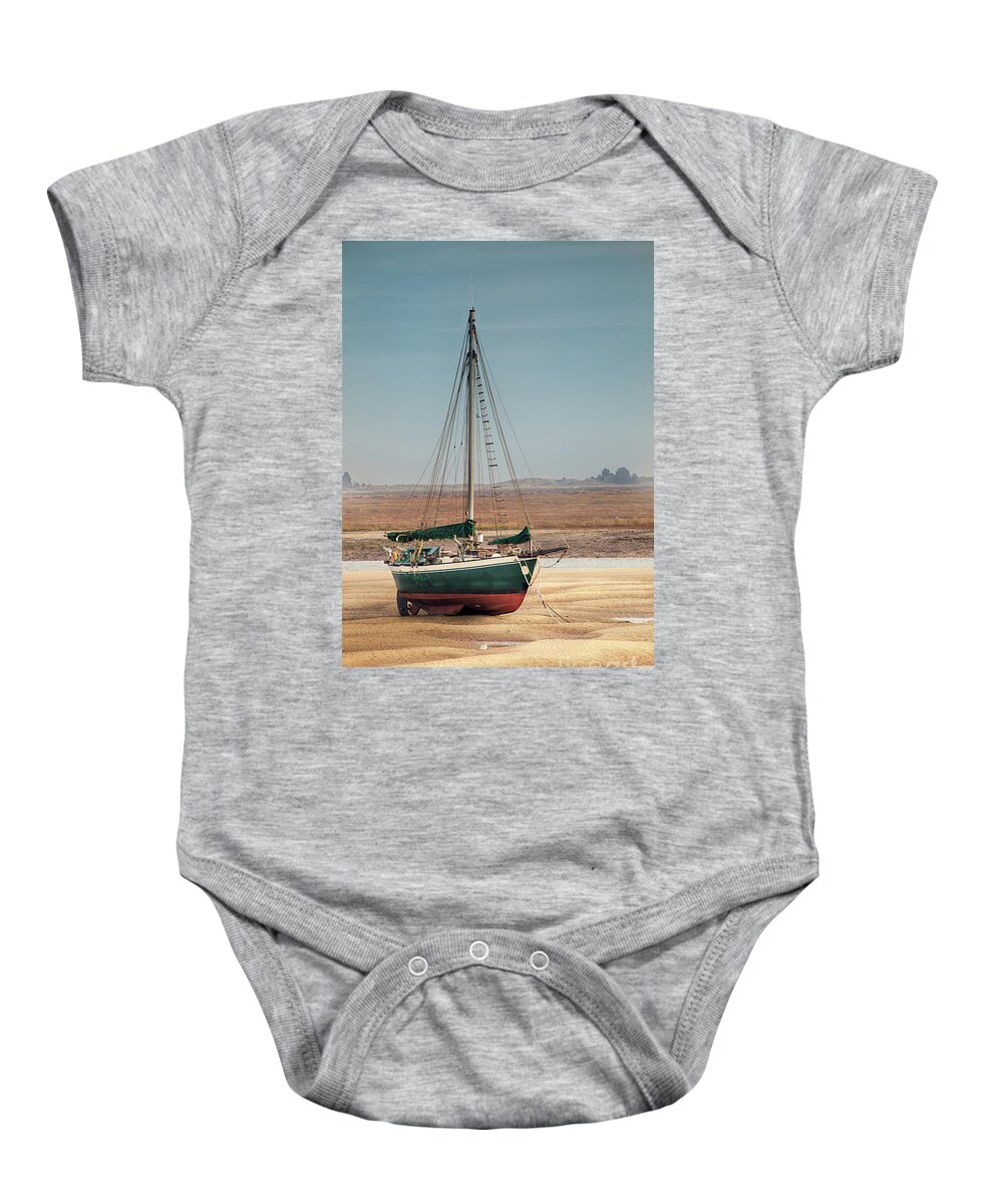 Wells Baby Onesie featuring the photograph Norfolk sail boat stranded at low tide by Simon Bratt