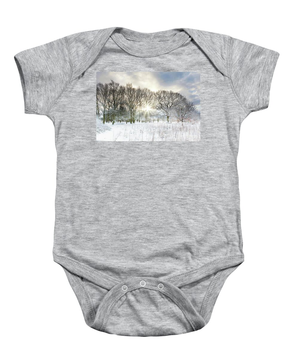 Snow Baby Onesie featuring the photograph Snow covered rural trees with early morning sunrise by Simon Bratt