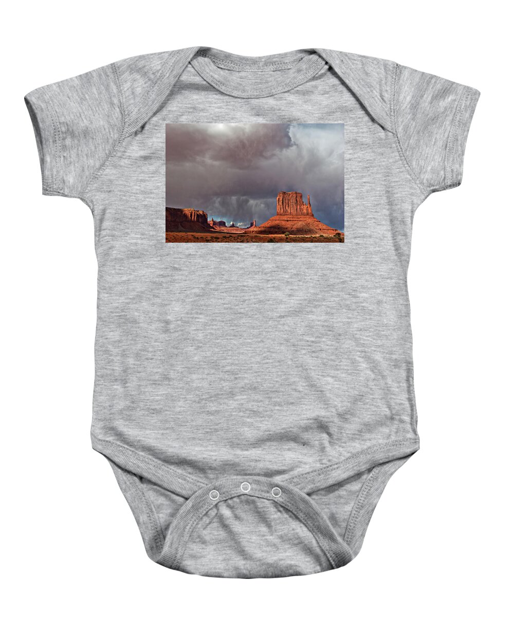 Desert Baby Onesie featuring the photograph Storm over Monument Valley by Wesley Aston
