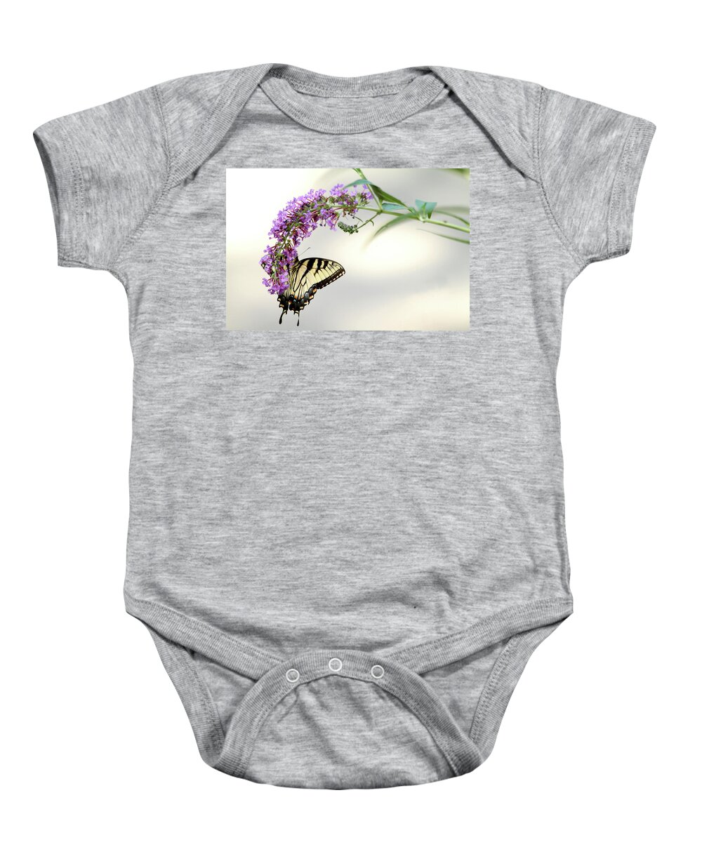 Butterfly Baby Onesie featuring the photograph Swallowtail on purple flower by Emanuel Tanjala