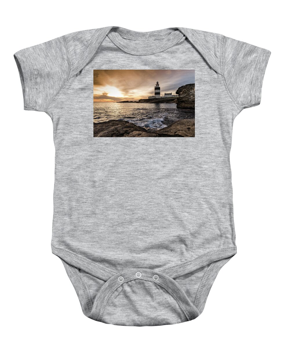 Hook Lighthouse Baby Onesie featuring the photograph The Hook at Sunset by Martina Fagan