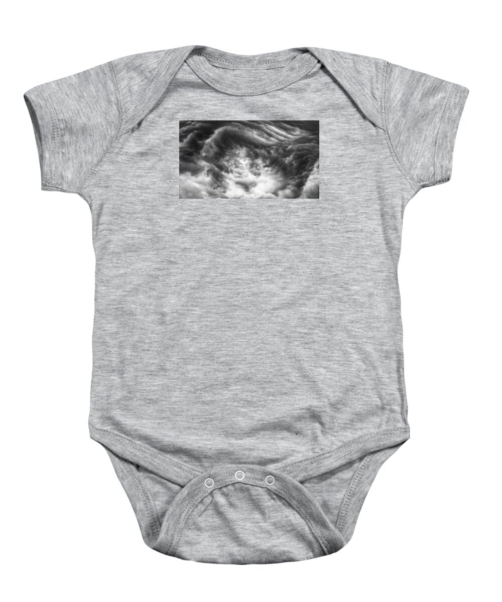 Storm Clouds Baby Onesie featuring the photograph The push back by Charles McCleanon