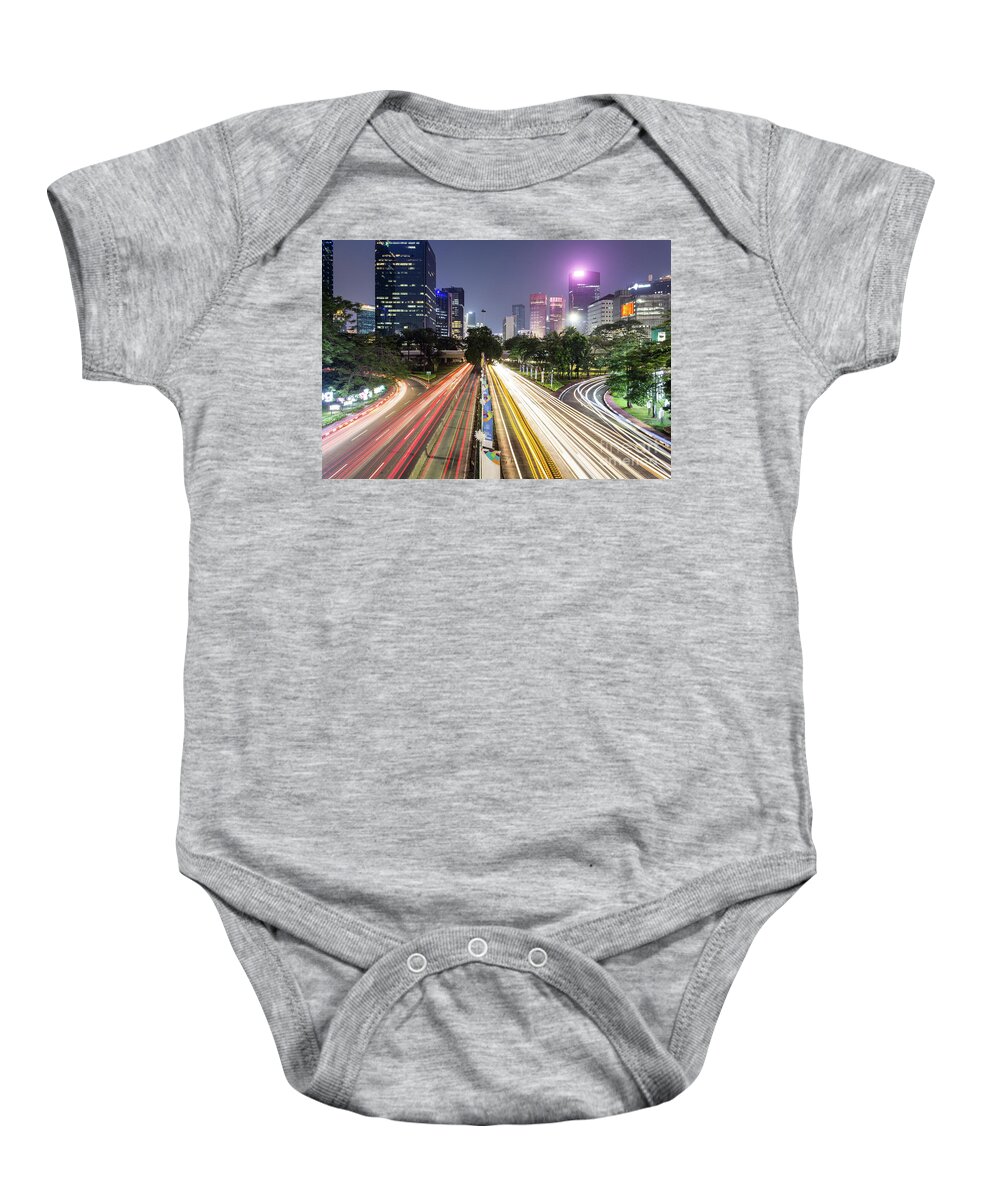Capital Cities Baby Onesie featuring the photograph Traffic night rush in Jakarta, Indonesia capital city. by Didier Marti