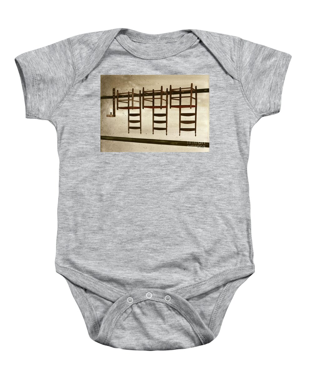 A Row Of Shaker Chairs Are Hung On Pegs Upside Down In The Center Family Dwelling At Pleasant Hill Shaker Village In Kentucky.  Baby Onesie featuring the painting Upside Down by Monte Toon