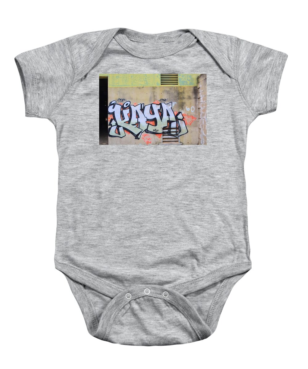 Wall Baby Onesie featuring the photograph Wall Graffiti by Josephine Buschman