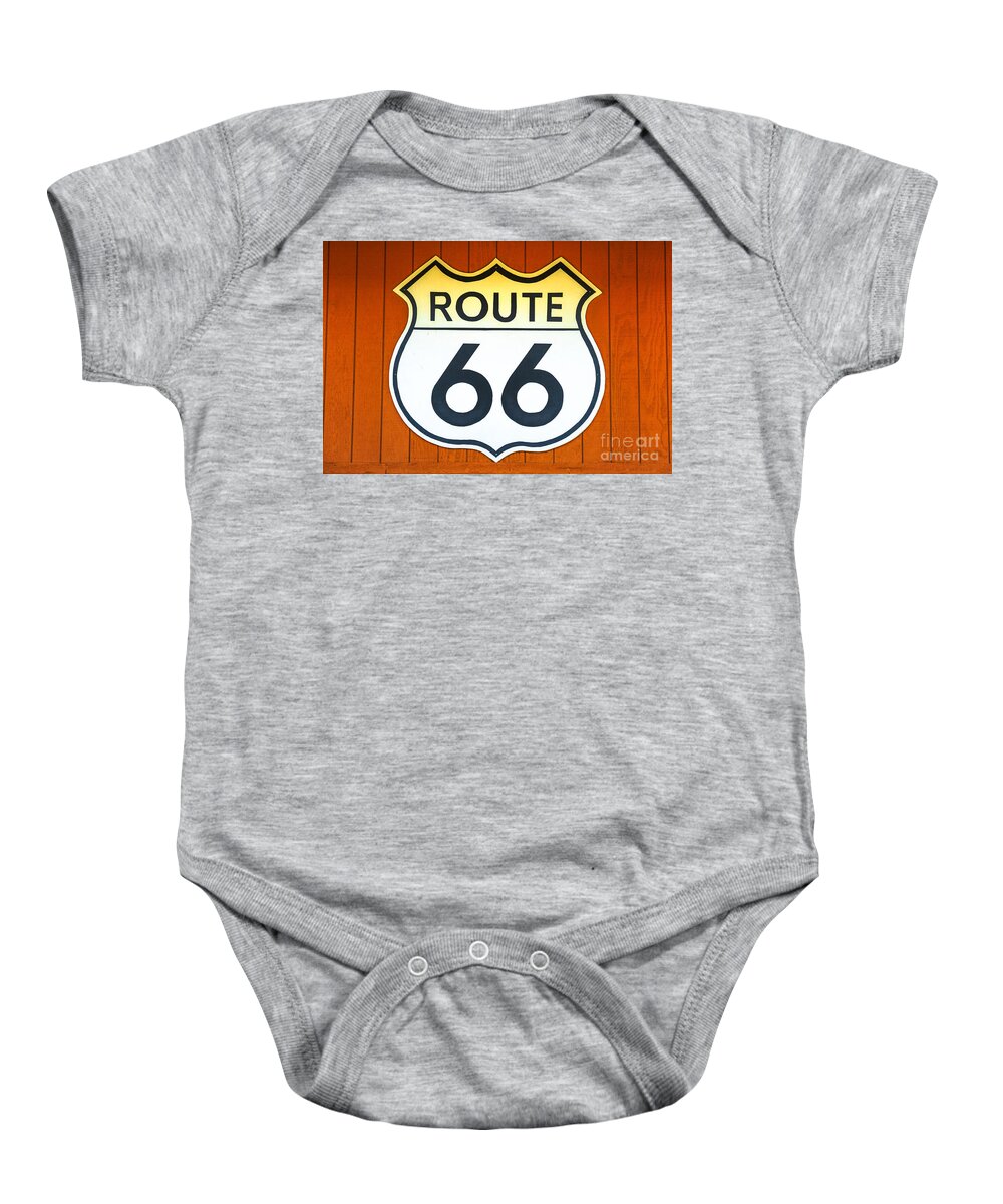 Route 66 Baby Onesie featuring the photograph Route 66 wooden background #1 by Benny Marty