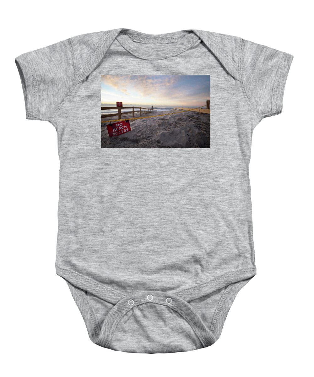 Beach Baby Onesie featuring the photograph Sunrise after a storm on the beach. #1 by Kyle Lee