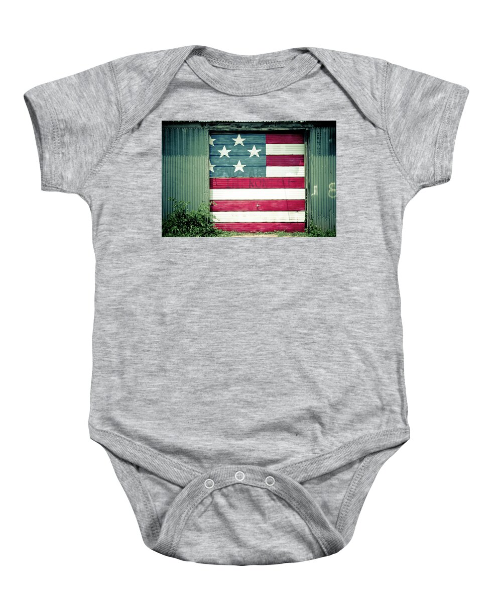 American Flag Baby Onesie featuring the photograph American Flag Garage Door by Toni Hopper