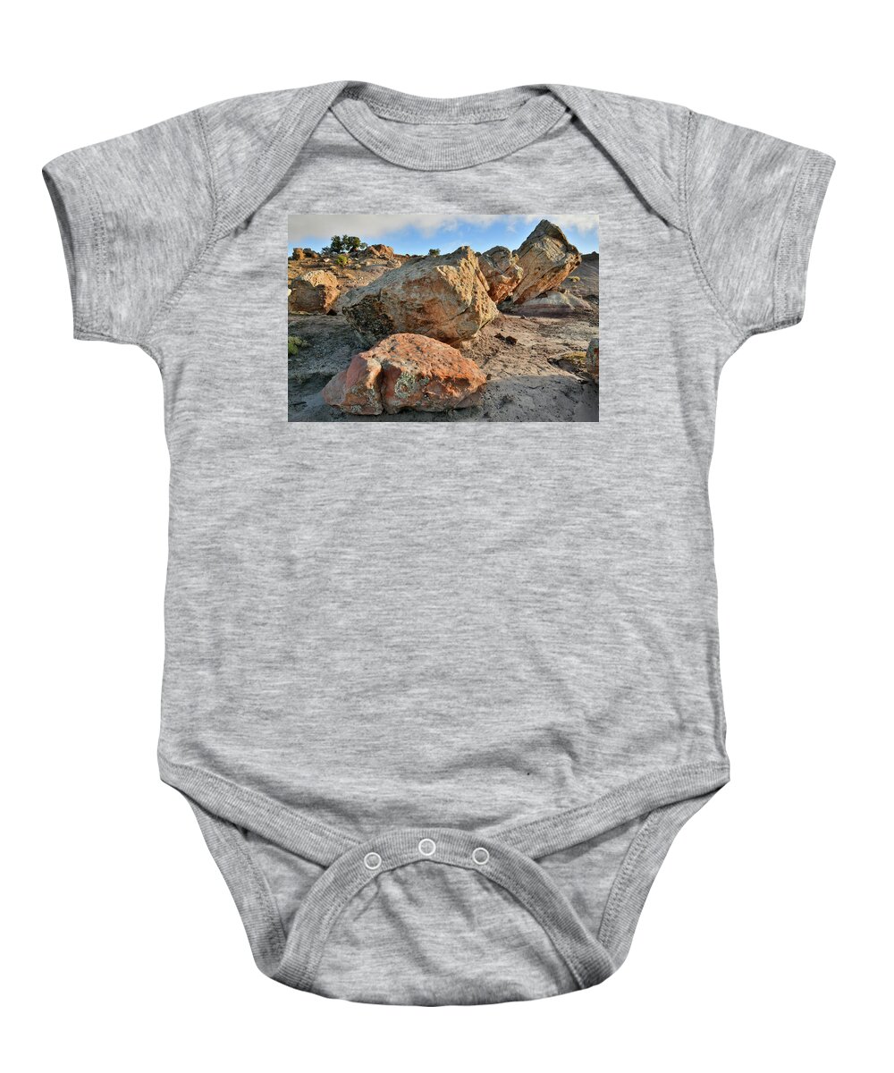 Little Park Road Bentonite Site Baby Onesie featuring the photograph Balanced Rocks in Bentonite Site by Ray Mathis