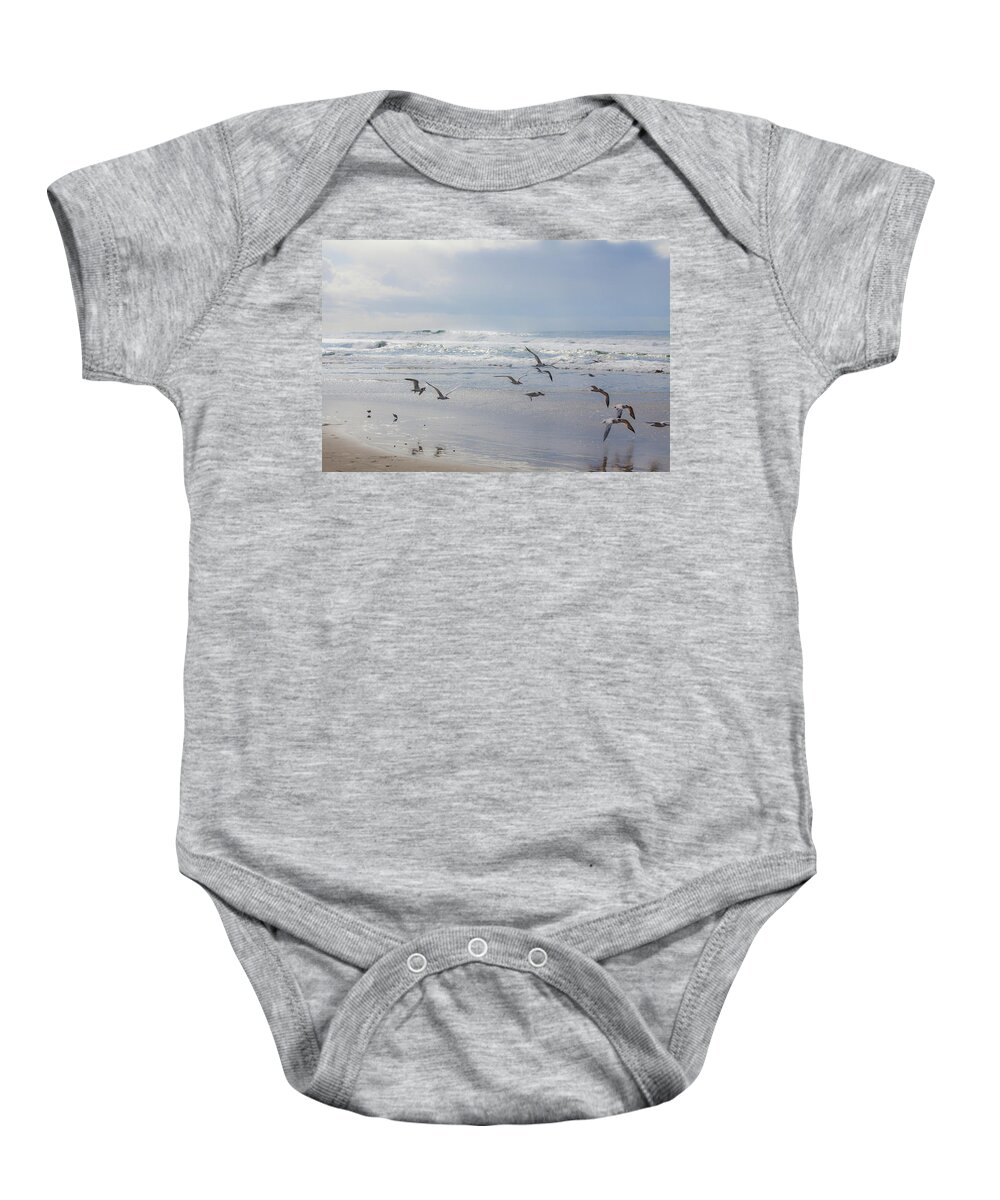  Baby Onesie featuring the photograph Bird Flight at Moonlight Beach by Catherine Walters
