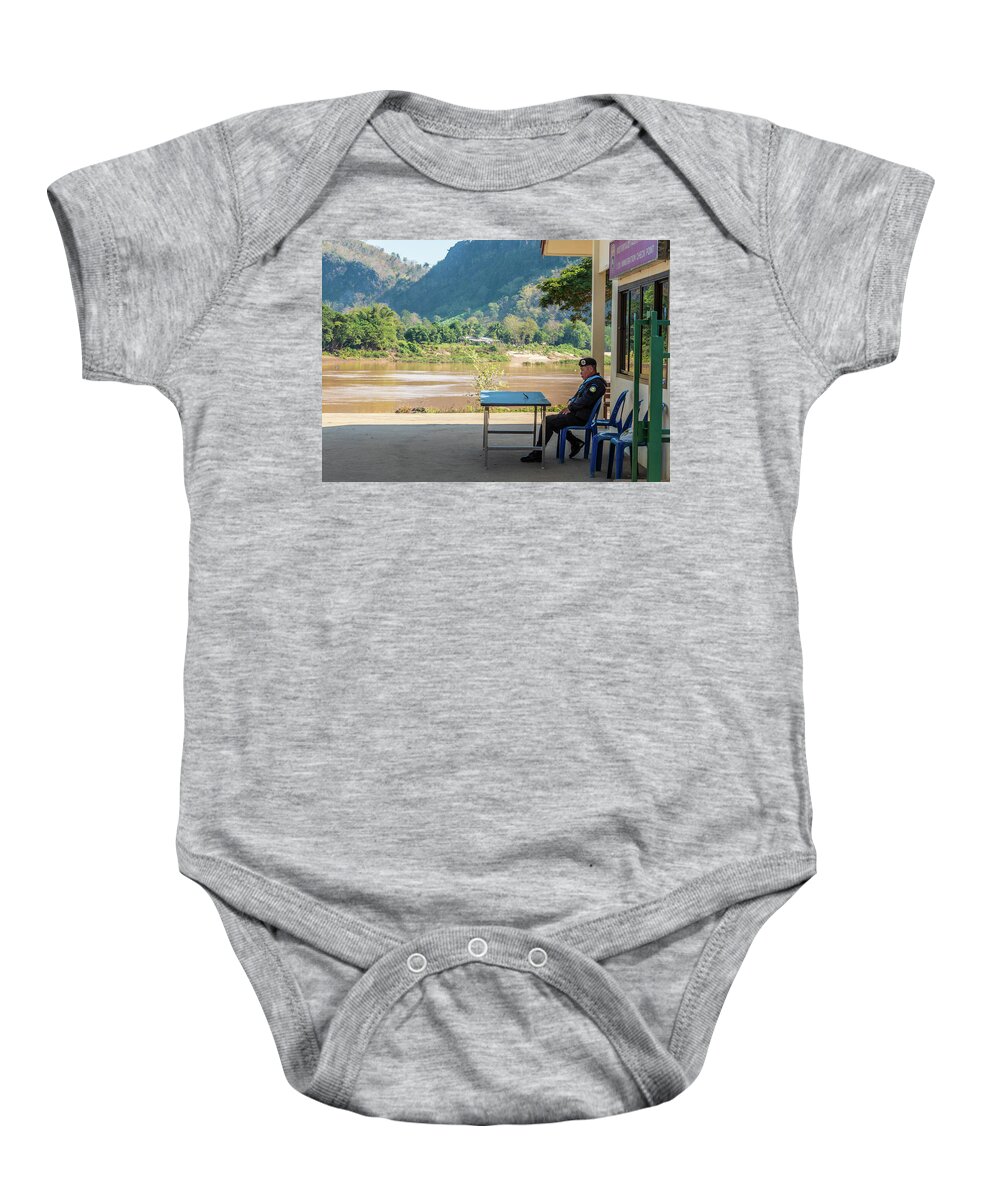 Laos Baby Onesie featuring the photograph Border guard hard at work by Jeremy Holton