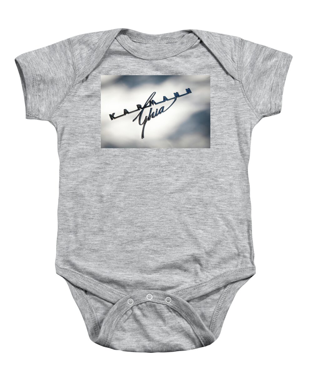 Karmann Ghia Baby Onesie featuring the photograph Logo of the famous Volkswagen Karmann Ghia sports car by Michalakis Ppalis
