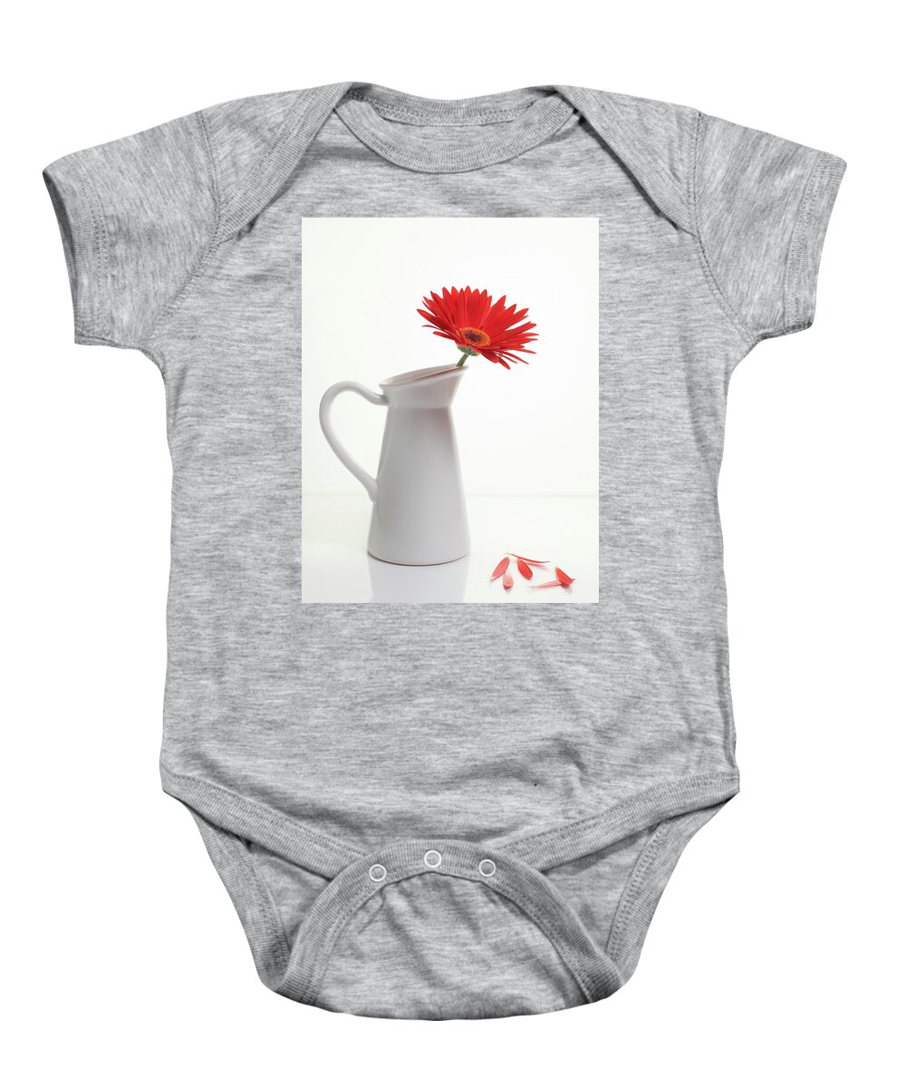Flower Baby Onesie featuring the photograph Red Gazania flower on a white stylish vase. Creative Still life by Michalakis Ppalis