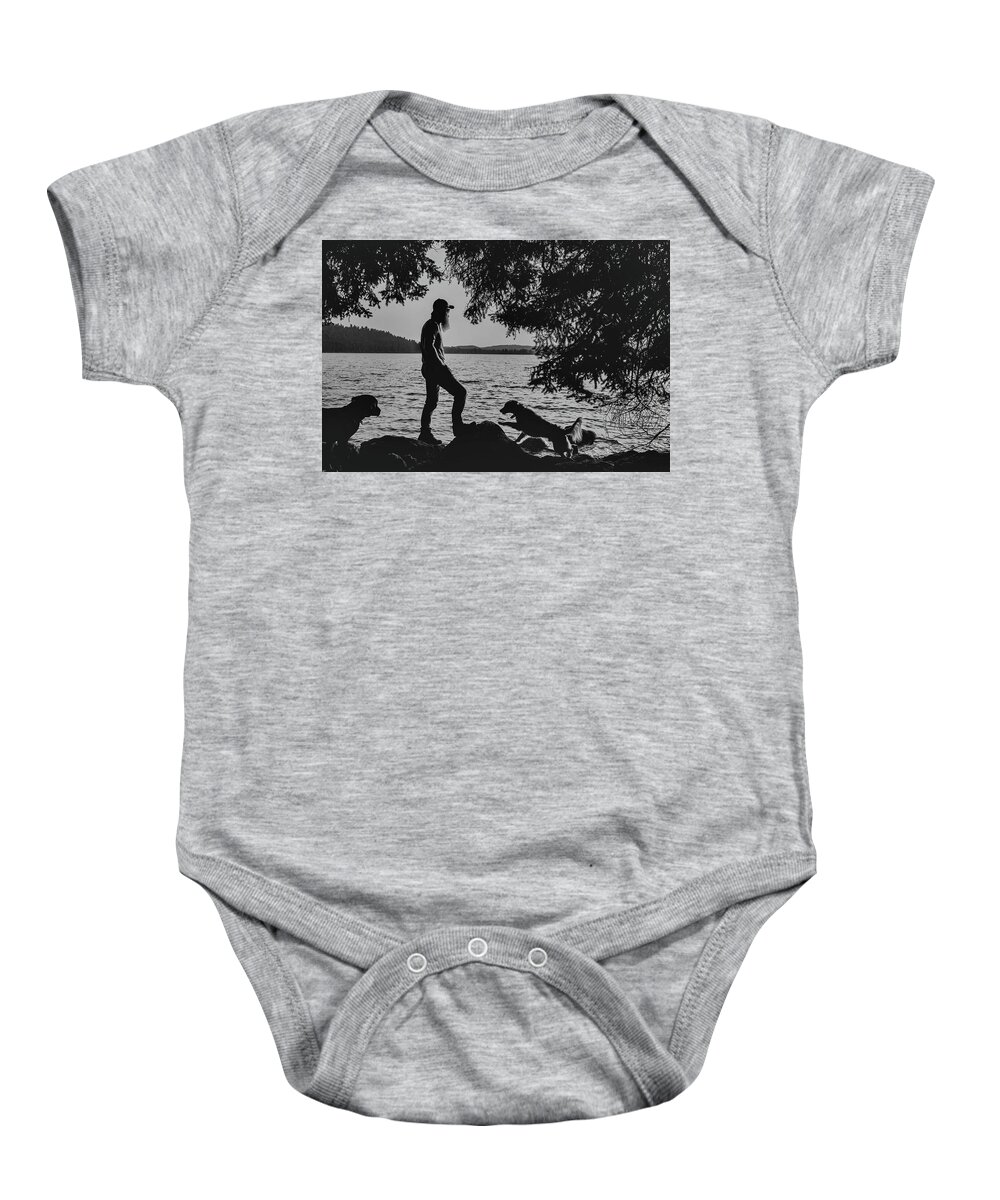 Dog Baby Onesie featuring the photograph Silhouette of dogs enjoying Half Moon Lake by Julieta Belmont