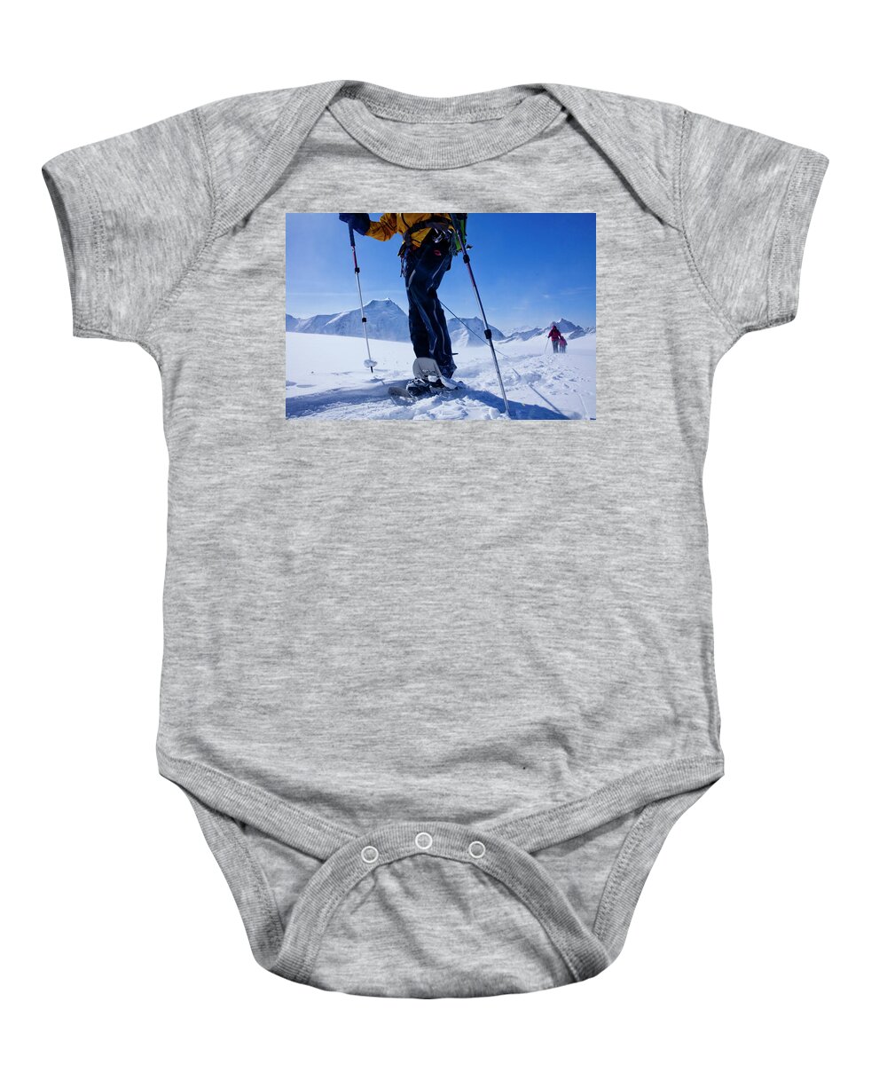 Estock Baby Onesie featuring the digital art Snowshoeing On Mountain by Christof Sonderegger