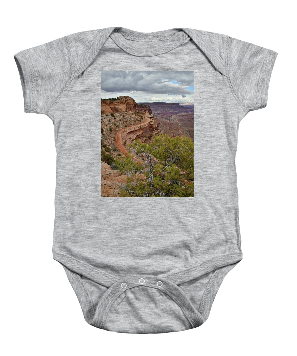 Canyonlands National Park Baby Onesie featuring the photograph Storm Clouds over Shafer Canyon in Canyonlands by Ray Mathis