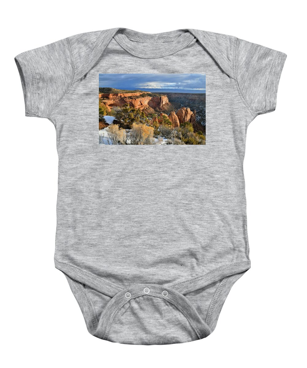 Colorado National Monument Baby Onesie featuring the photograph Sun Peaks Through Onto Coke Ovens by Ray Mathis