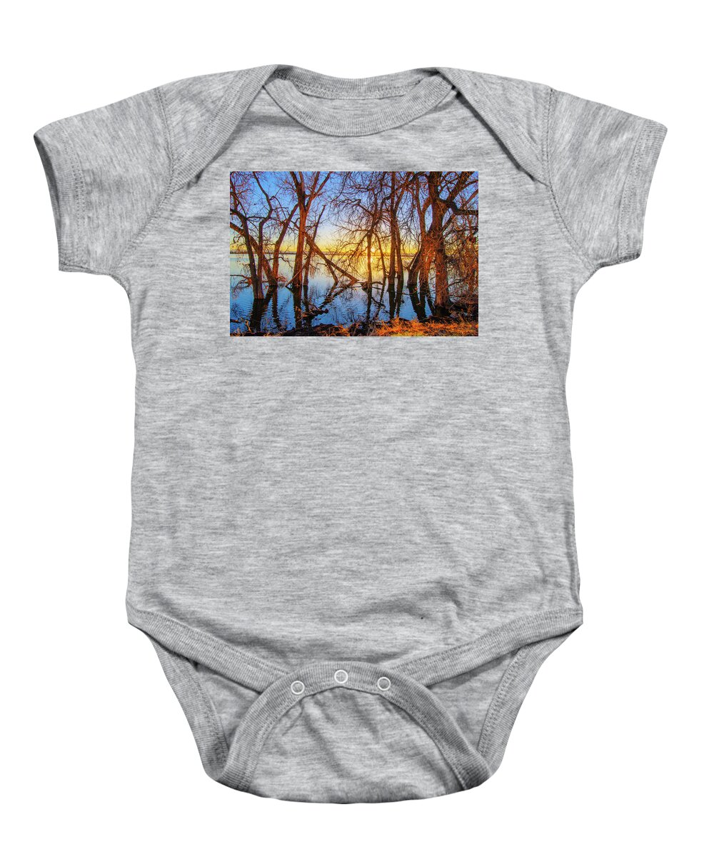 Autumn Baby Onesie featuring the photograph Twisted Trees On Lake at Sunset by Tom Potter