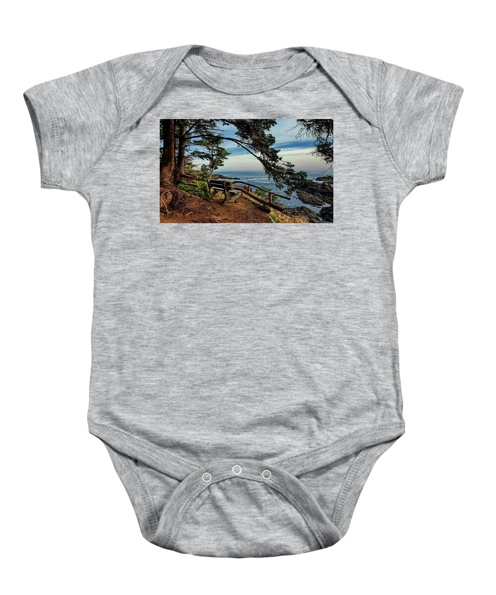  Alex Lyubar Baby Onesie featuring the photograph Bench on the cliff over the seashore by Alex Lyubar