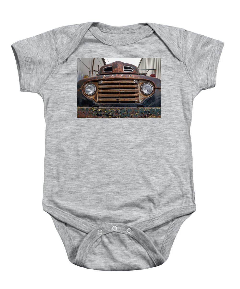 Abandoned Baby Onesie featuring the photograph Close Up Front of Old Ford Truck by Dutch Bieber