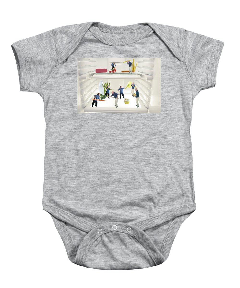 Profile Baby Onesie featuring the photograph Couple fighting over healthy versus junk foods by Karen Foley