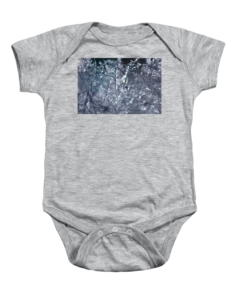 Beautiful Baby Onesie featuring the photograph Entangled snowflakes are shimmering in the blue light of winter by Ulrich Kunst And Bettina Scheidulin