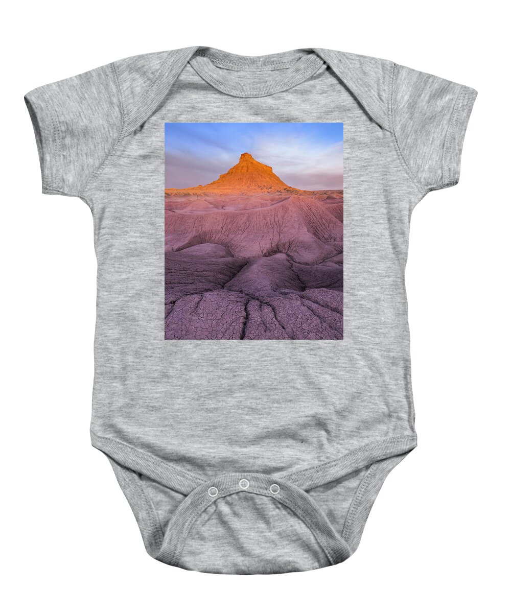 Art Baby Onesie featuring the photograph Factory Butte by Edgars Erglis