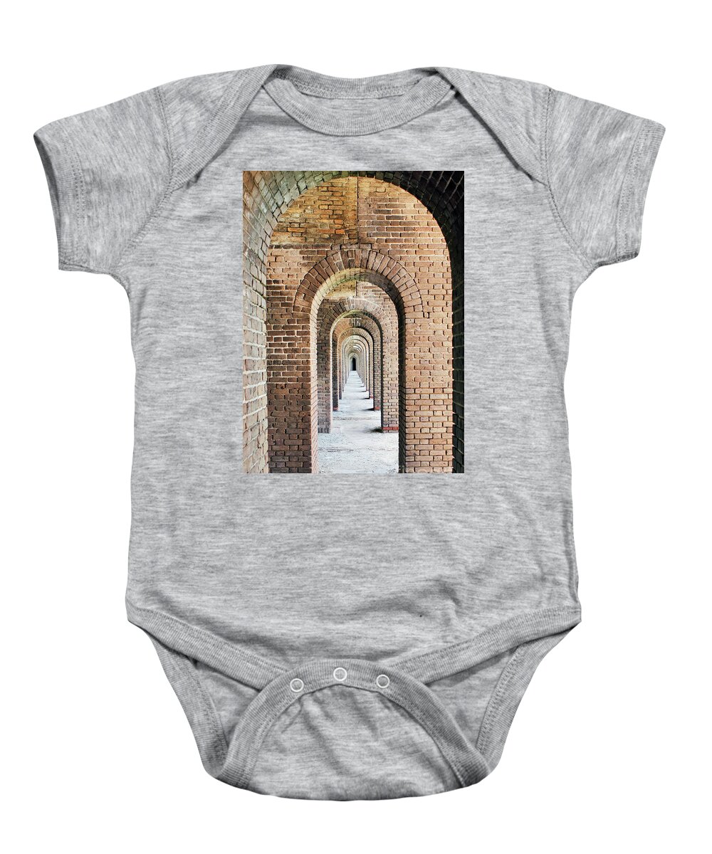 Arches; Fort Jefferson; Entryway; Doorway; Brick; Bricks; Fort; Civil War; Prison; Dry Tortugas; Key West; National Park; Park; Repetition; Perspective; Red; Gray; Vertical; Architecture; Baby Onesie featuring the photograph Fort Jefferson Arches by Tina Uihlein