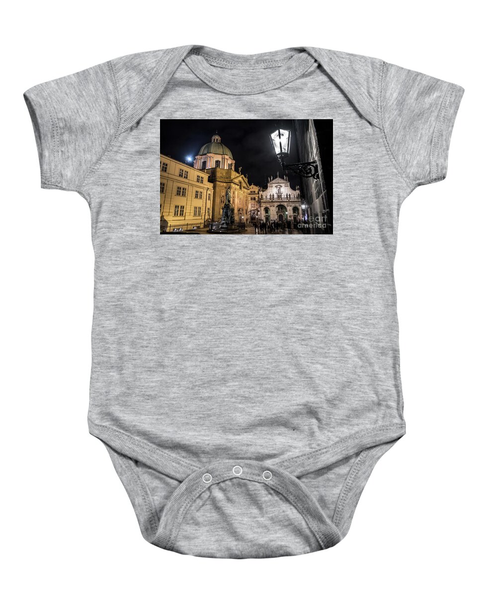 Ancient Baby Onesie featuring the photograph Historic Buildings Beneath The Tower Of Charles Bridge In The Night In Prague In The Czech Republic by Andreas Berthold