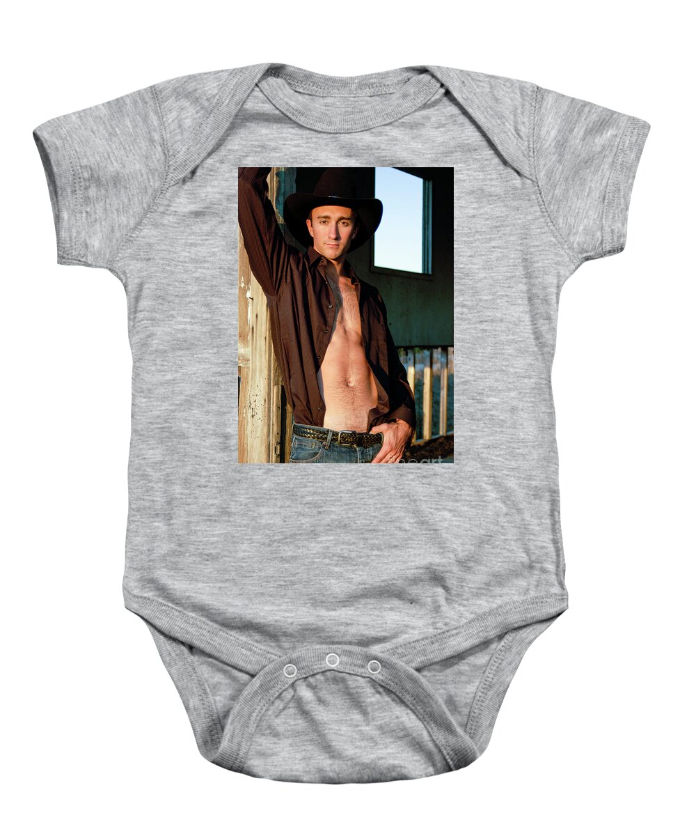 Young Baby Onesie featuring the photograph Hot hairy chested cowboy by Gunther Allen
