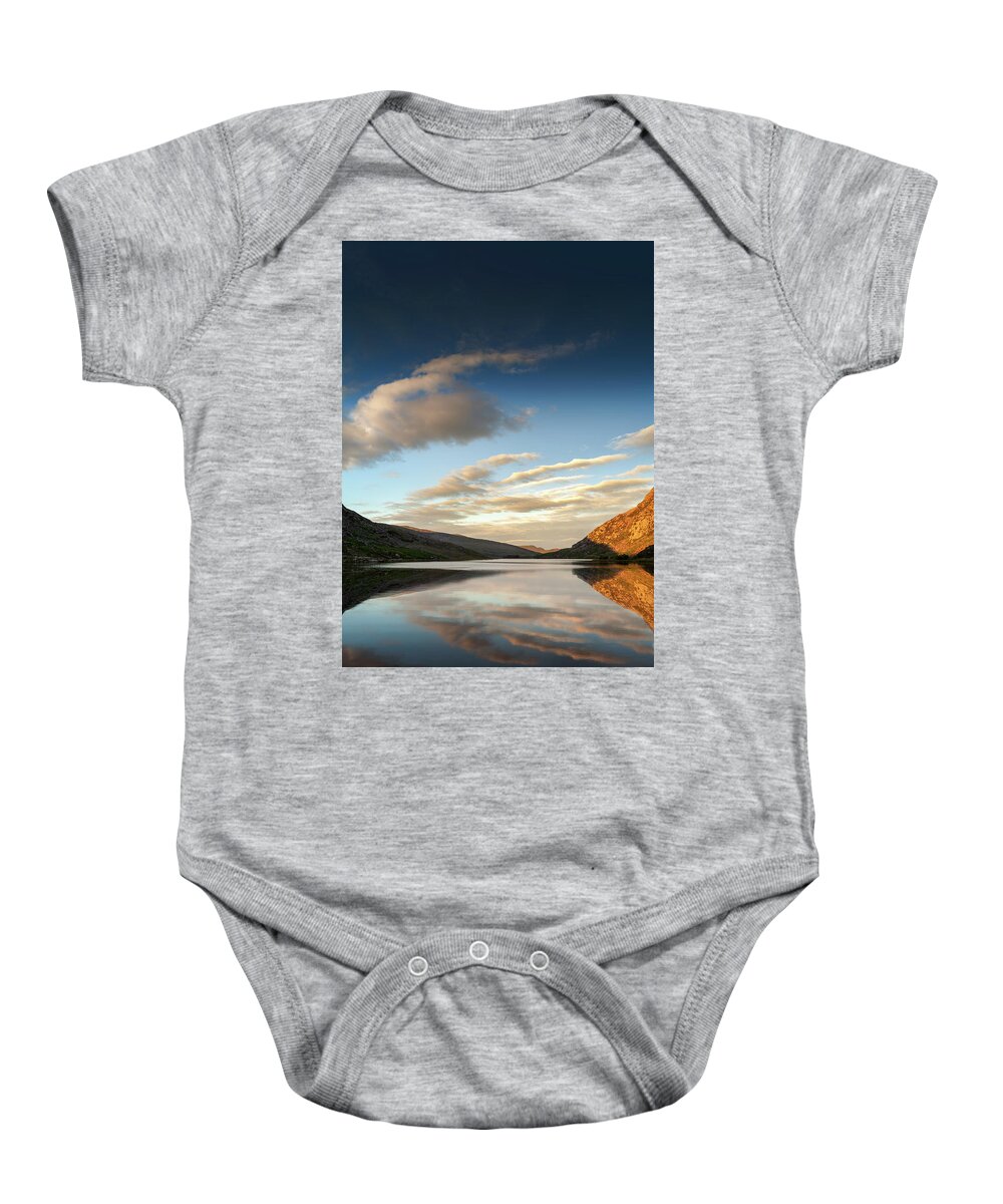 Llyn Ogwen Baby Onesie featuring the photograph Mountains reflected into Llyn Ogwen at sunset, North Wales by Victoria Ashman