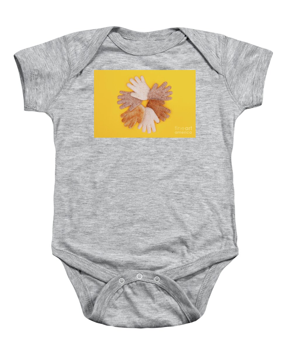 Hands Baby Onesie featuring the photograph Multicultural hands circle concept made from bread by Simon Bratt