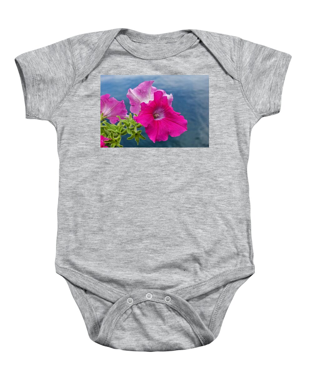 Lake Baby Onesie featuring the photograph Pink Petunias Above the Lake by Russel Considine