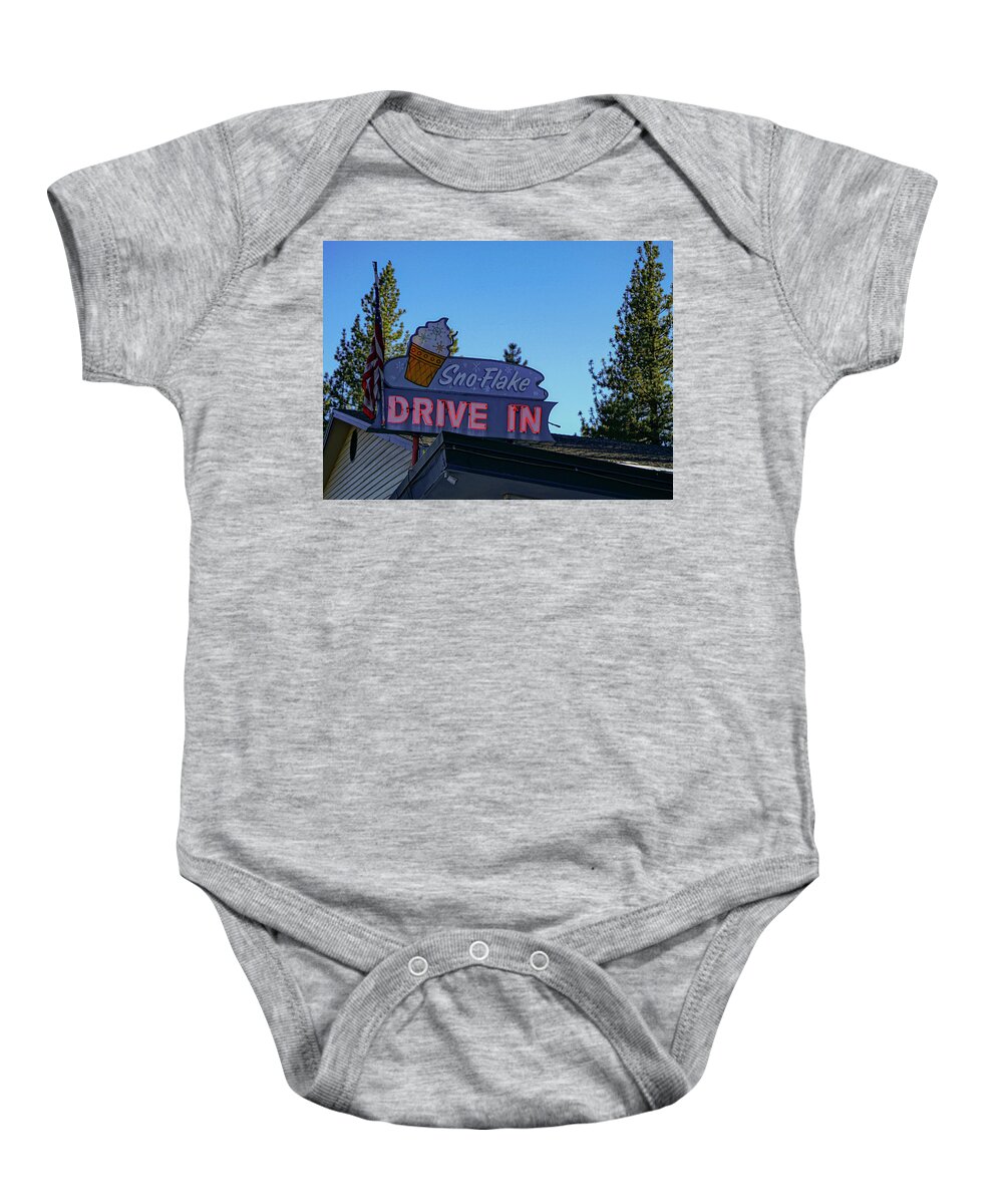 Neon Baby Onesie featuring the photograph Sno-Flake Drive In at Dusk by Matthew Bamberg