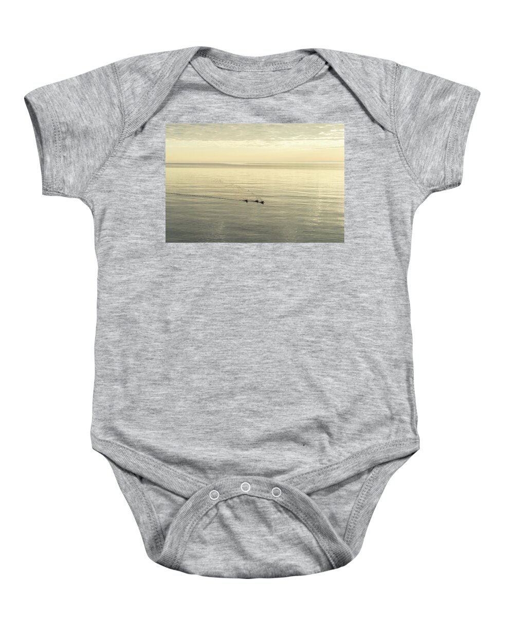 Soft Breeze Baby Onesie featuring the photograph Soft Breeze and Pearly Ripples - a Trio of Ducks on a Lake by Georgia Mizuleva