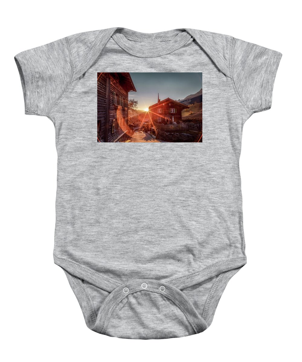 Breil Baby Onesie featuring the photograph Sunset on the small mountain village by Benoit Bruchez