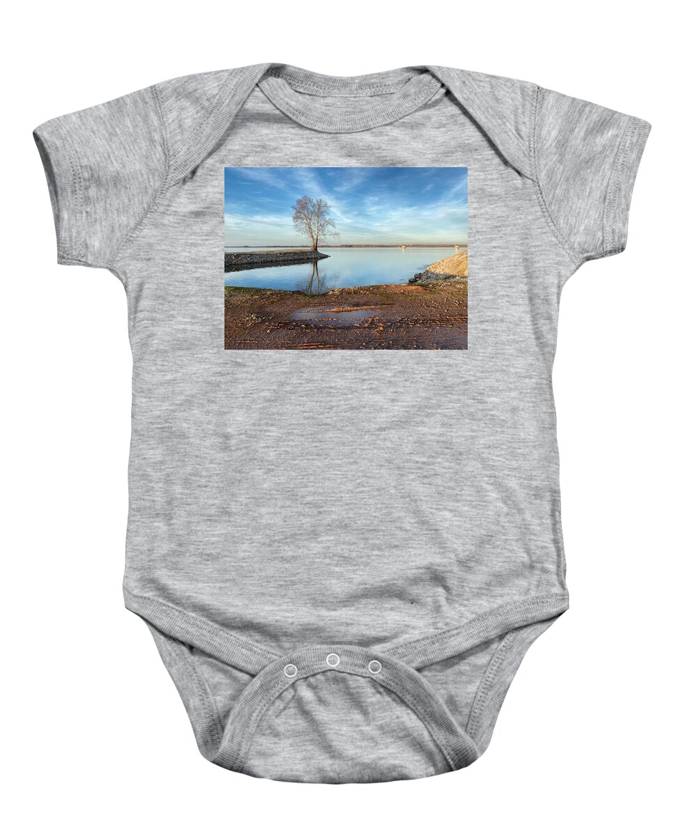 Tree Baby Onesie featuring the photograph Tree on the Edge of a Bay by Steven Gordon