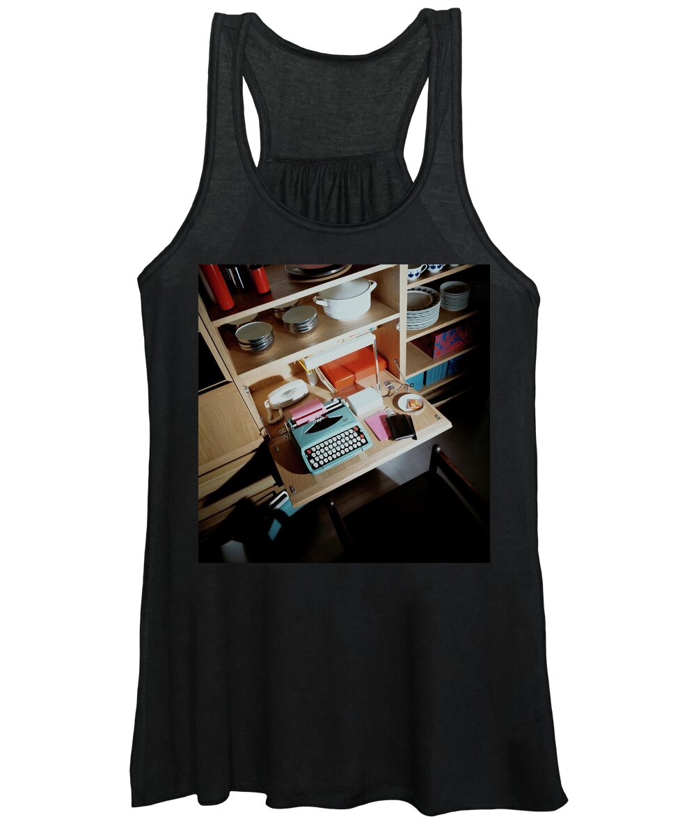 Indoors Women's Tank Top featuring the photograph A Cupboard With A Blue Typewriter by Ernst Beadle