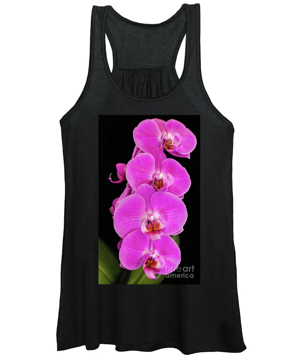 Pink Orchid Women's Tank Top featuring the photograph Pink orchid against a black background by Andy Myatt
