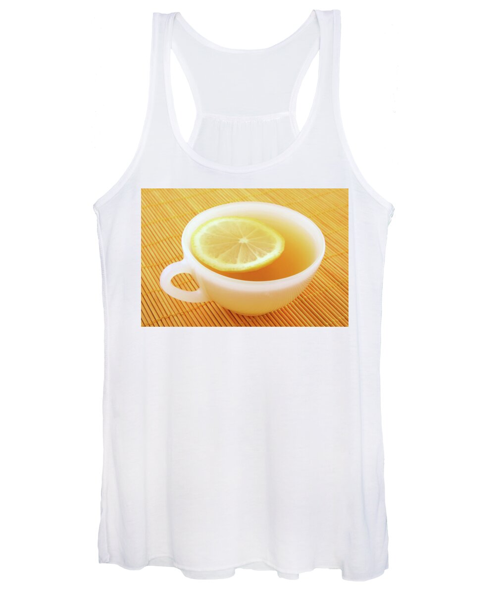 Tea Women's Tank Top featuring the photograph Cup of tea with lemon in warm golden light by GoodMood Art