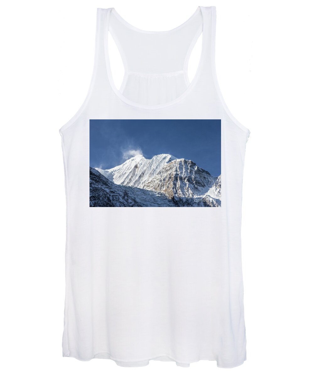 Annapurna Circuit Women's Tank Top featuring the photograph Sunrise over the Gangapurna peak at 7545m in the Himalayas in Ne by Didier Marti